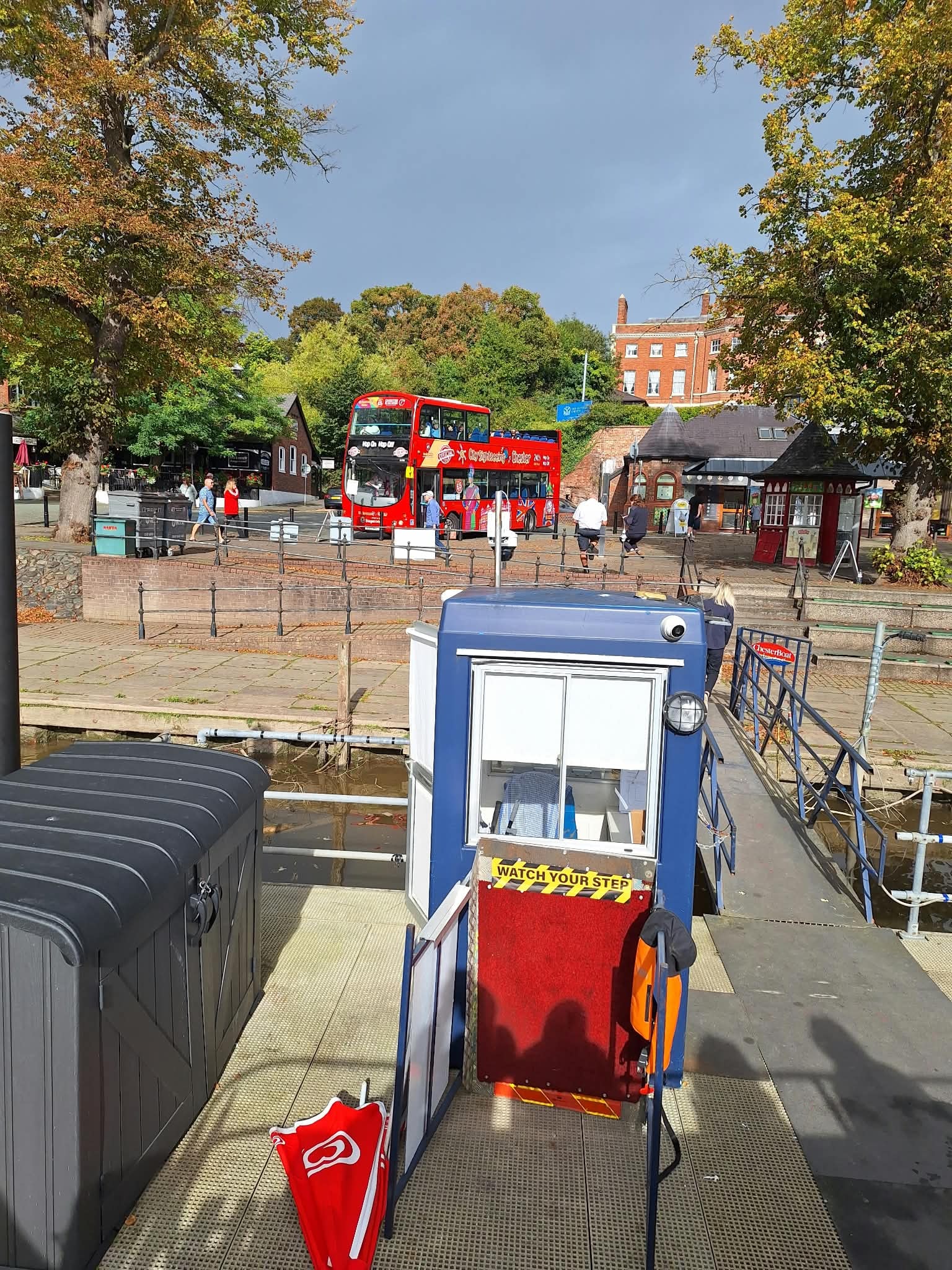 All aboard! The open-top river bus with Chester's famous red tour bus in the background. Or the City Sightseeing Bus.